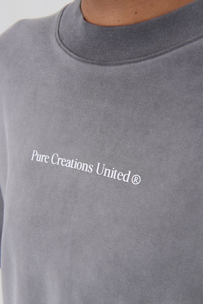 Front view of the PURE Áurea Grey Wash Oversized Tee showcasing its relaxed fit and washed grey color