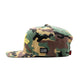 Front view of the green camo snapback hat with flat brim and embroidered Crenshaw logo prominently displayed