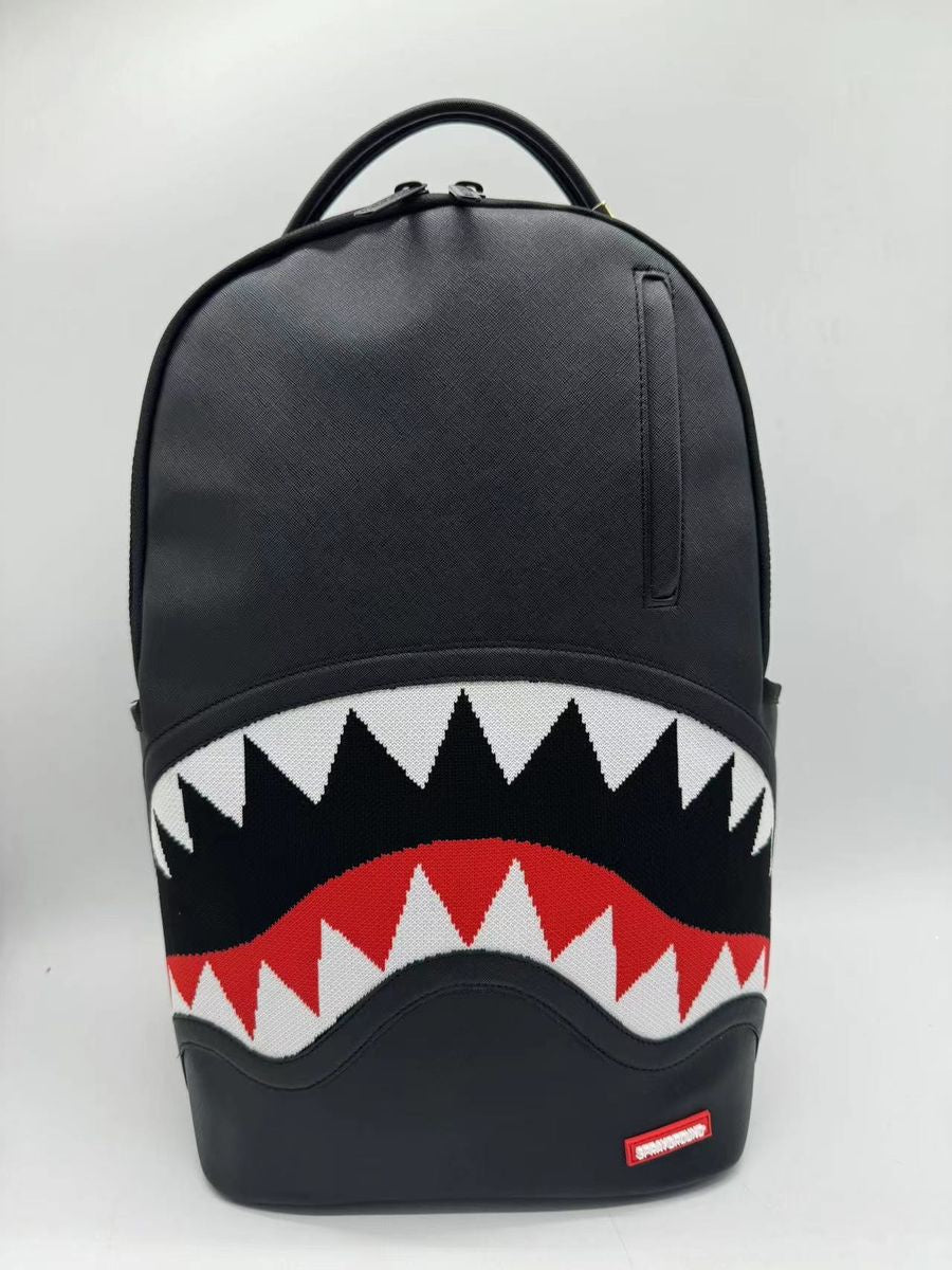 Close-up of Sprayground Fly Knit Shark Mouth Backpack made from 100% PVC material