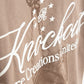 Artistic shot emphasizing the natural brown color and relaxed fit of the PURE Knockout Gloves Tee