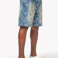 Side profile highlighting the textured embellishments and relaxed fit of vintage blue denim shorts