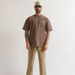 Detailed shot of fabric weight label indicating 250 grams for the PURE Monclair Brown Tee