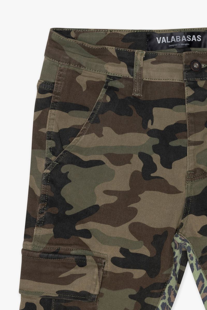 Full-length view showcasing the stacked flare style and unique camo print on Valabasas Commander 30 jeans