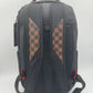 Side angle of Sprayground Dose Of Check Deux Backpack highlighting sturdy construction and size