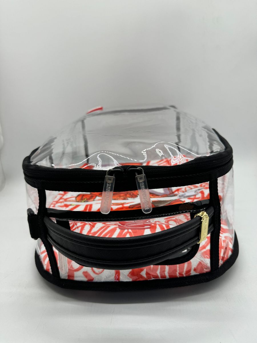 Detailed image of the Sprayground Bear Grills DLX Clear Backpack with transparent design and ample storage capacity