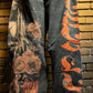 Full-length image of Amor Jeans Black Baggy Jeans displayed on a model emphasizing the stylish digital print and relaxed style