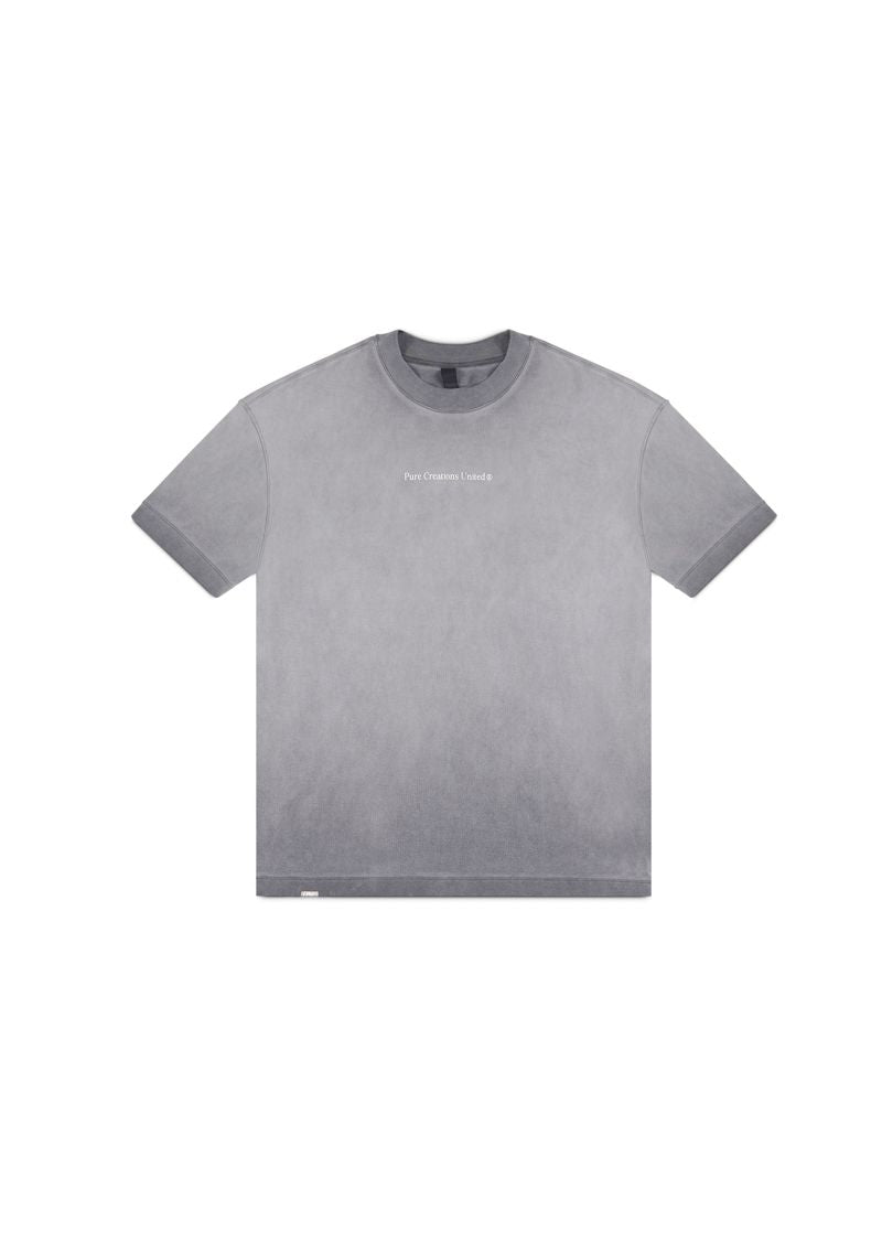  Side profile of the PURE Áurea Grey Wash Oversized Tee emphasizing its loose, comfortable fit and washed grey tone