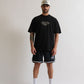 Side profile of the PURE Monclair Black Tee emphasizing its oversized fit and comfortable cotton material