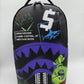 A black Sprayground Shark Central Stencils backpack with bold shark graphic design