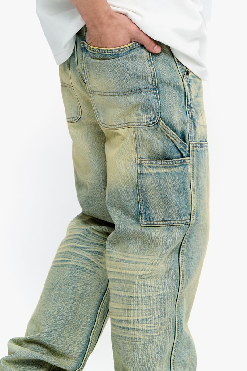Close-up of the distressed details and vintage wash effect on Valabasas Mr Straight denim jeans