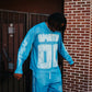 A blue oversized long sleeve shirt featuring a lightning graphic design from Mixed Emotion