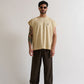 Side angle showing the sleeveless cut and relaxed box fit of the PURE Monclair Horses Cream Tank top