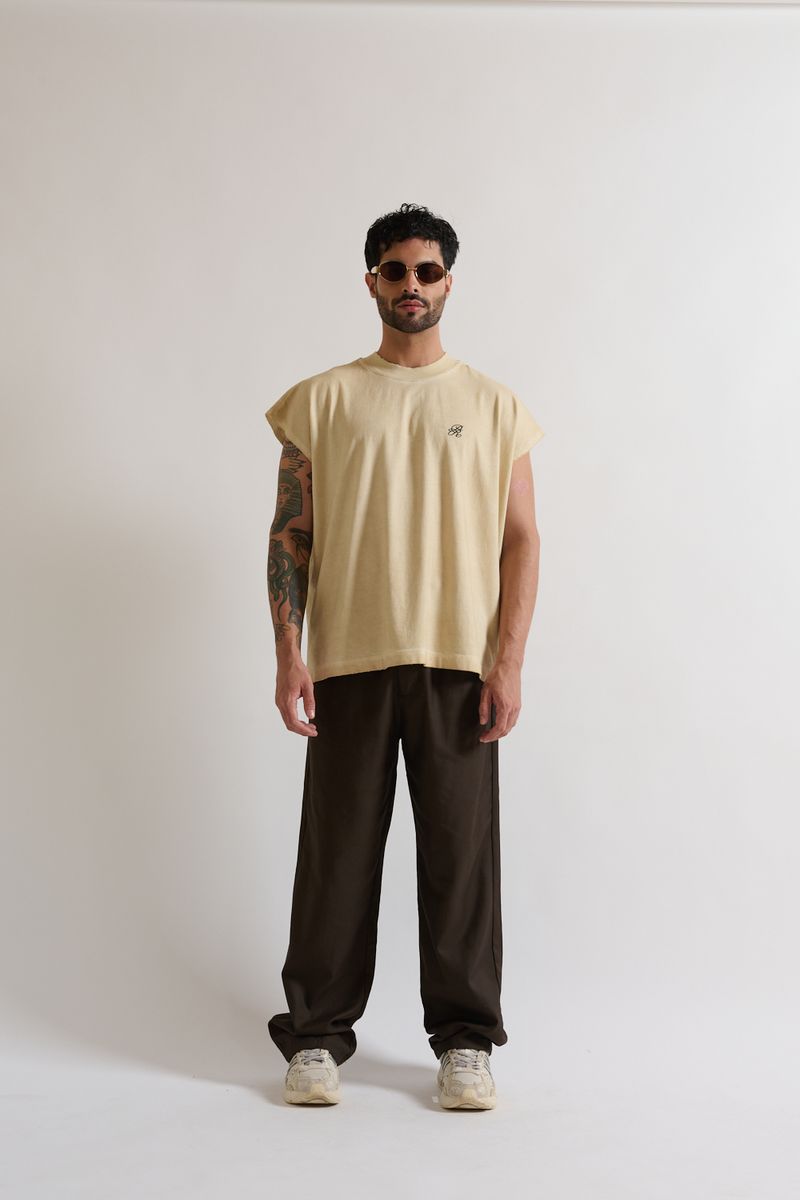 Side angle showing the sleeveless cut and relaxed box fit of the PURE Monclair Horses Cream Tank top