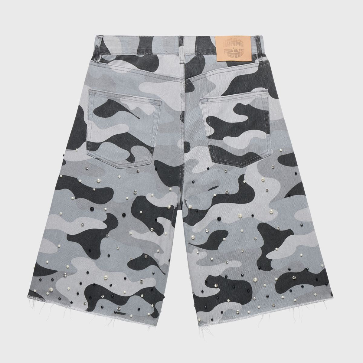 Structured wide-leg denim shorts with military-inspired snow camo pattern, adorned with shimmering pearls and rhinestones for a glamorous streetwear look