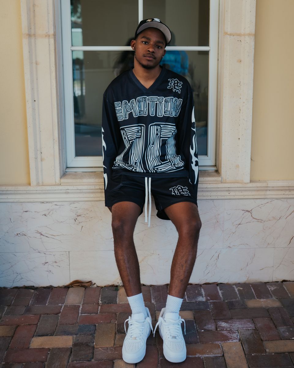 Fashionable oversized long sleeve shirt in black with a vivid lightning motif for a modern look