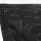 Side view of the black waxed denim jeans with stacked cut 
