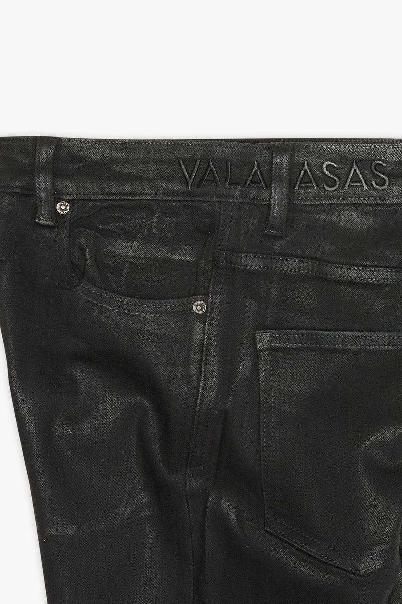  Side view of the black waxed denim jeans with stacked cut 