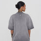 Back view of the oversized T-shirt displaying its relaxed silhouette and high-quality washed grey cotton fabric