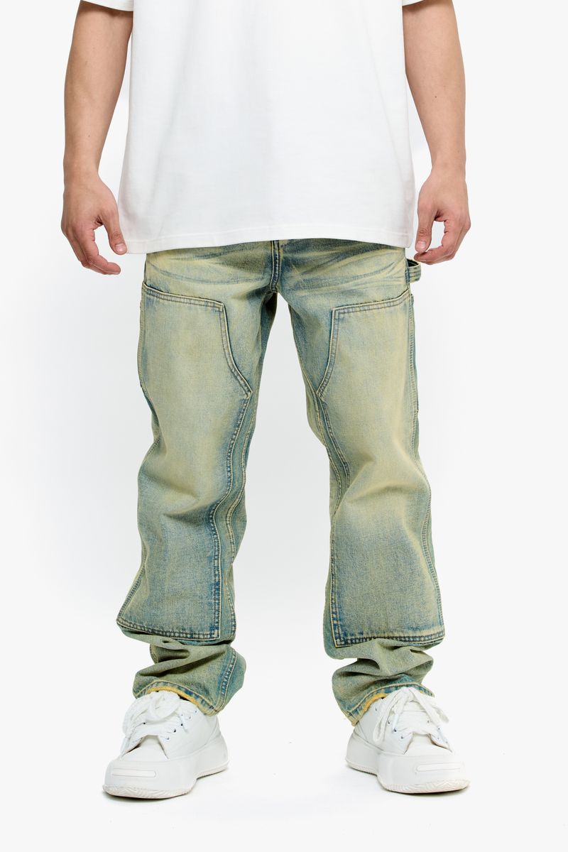 Full body shot of a model wearing Valabasas Mr Straight vintage wash denim jeans, demonstrating fit and style