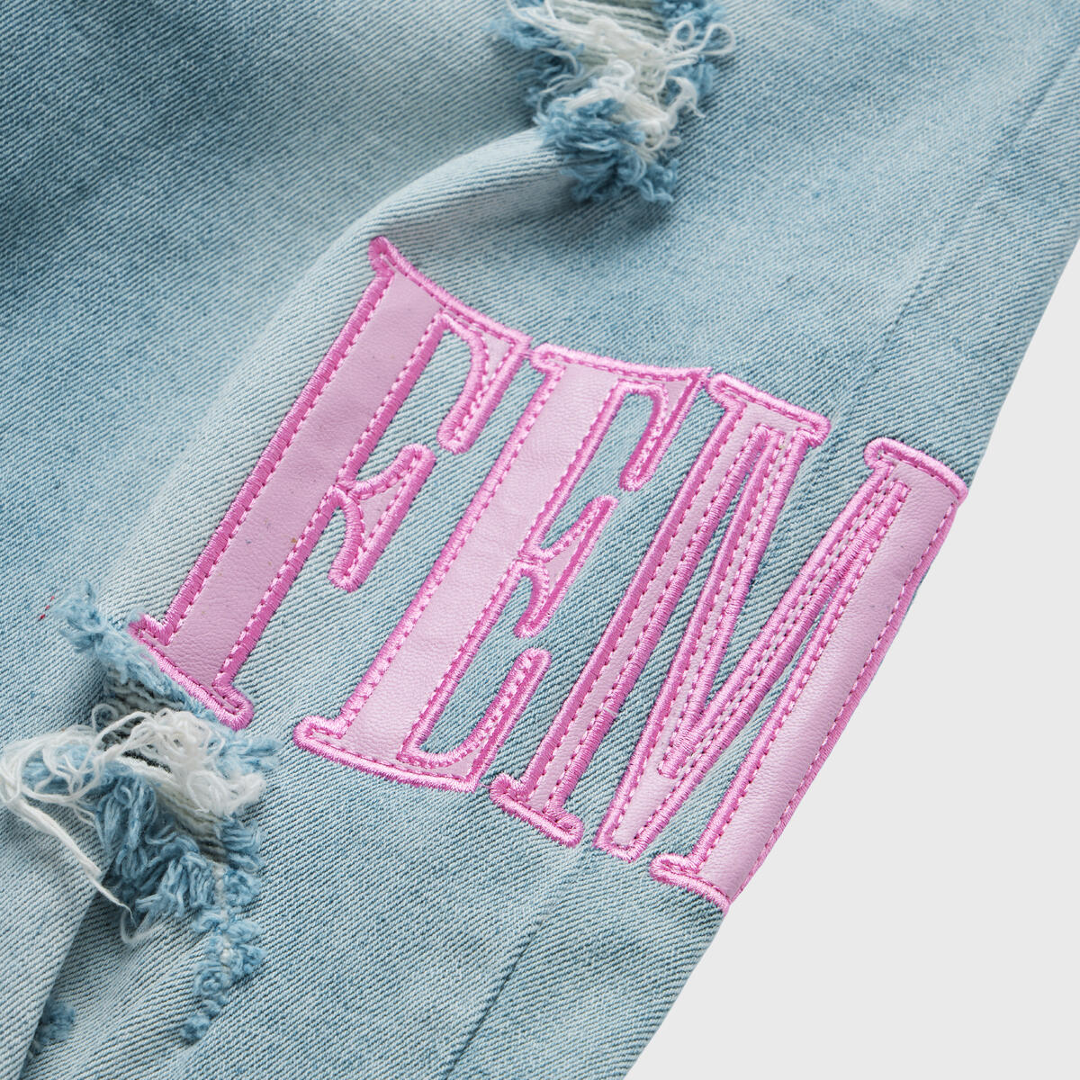 Close-up image of the Homme + Femme Letterman Blue Denim w/Powder Pink jacket, featuring a stylish design with a denim base and powder pink accents