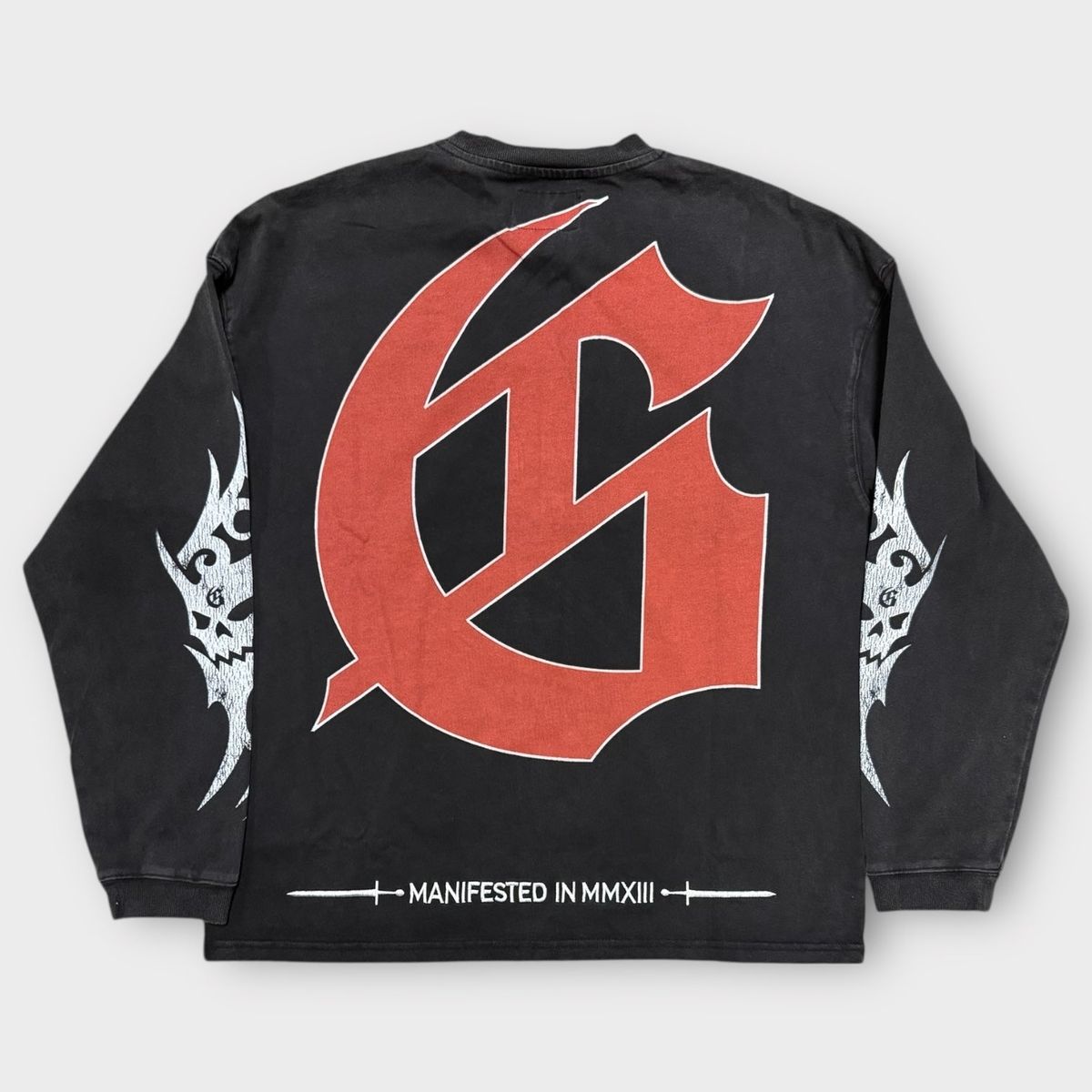 Close-up of the limited edition Godspeed Sea Sick Long Sleeve highlighting the textured washed fabric, vibrant artwork, and exclusive numbering of this collectible apparel piece