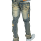 Close-up of Makobi Moreli Dirt Denim Jeans showing rugged dirt-inspired design and durable fabric