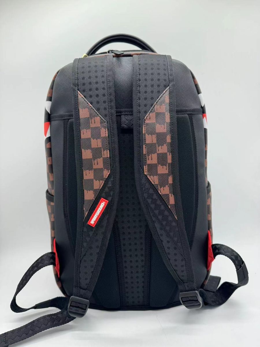 Full view of the Sprayground One Eye Brown Check Backpack highlighting its size, structure, and brown check pattern