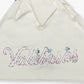 Full view of the Valabasas Gem White Tee styled casually, showcasing its simple yet elegant design