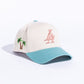 Cream snapback hat with teal and pink accents, featuring Paradise LA embroidery (REF609)