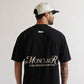 Close-up of the PURE Monclair Black T-shirt highlighting the high-quality black color and fabric weight of 200 grams