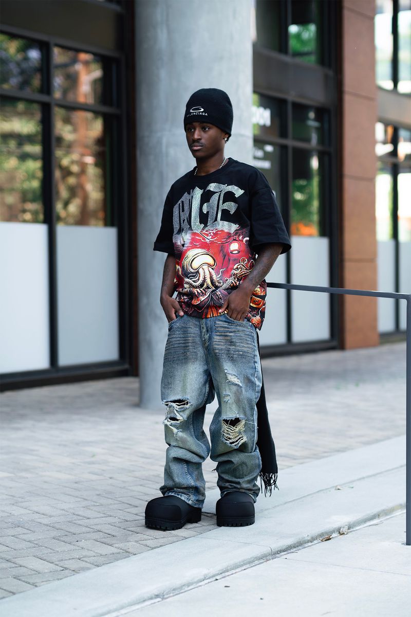 Front perspective of the black Mixed Emotion Octopus Rhinestone T-shirt emphasizing its eye-catching design