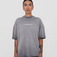 Detailed shot of the fabric showing the smooth texture and durable 350-gram weight of the PURE Áurea Grey Wash Tee