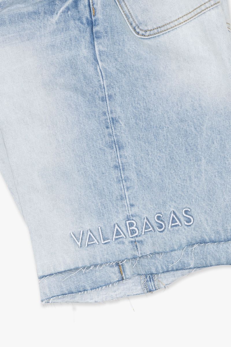 Bright light blue wash denim shorts labeled Mr Shorts from Valabasas, stylish casual men's summer wear with distressed details and comfortable fit