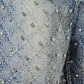 Fashion-forward aqua blue shorts showcasing hand-applied embellishments, distressed accents, perfect for summer outings