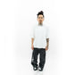 Side profile of the Faith+Figures Faith+ Jumbo SS Tee emphasizing its clean stitching and casual everyday wear appeal