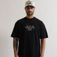Pure Monclair Black Tee front view showcasing oversized fit and 100% cotton fabric