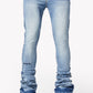 Guapi Pacific Blue Basics Stacked Denim jeans laying flat on a wooden surface
