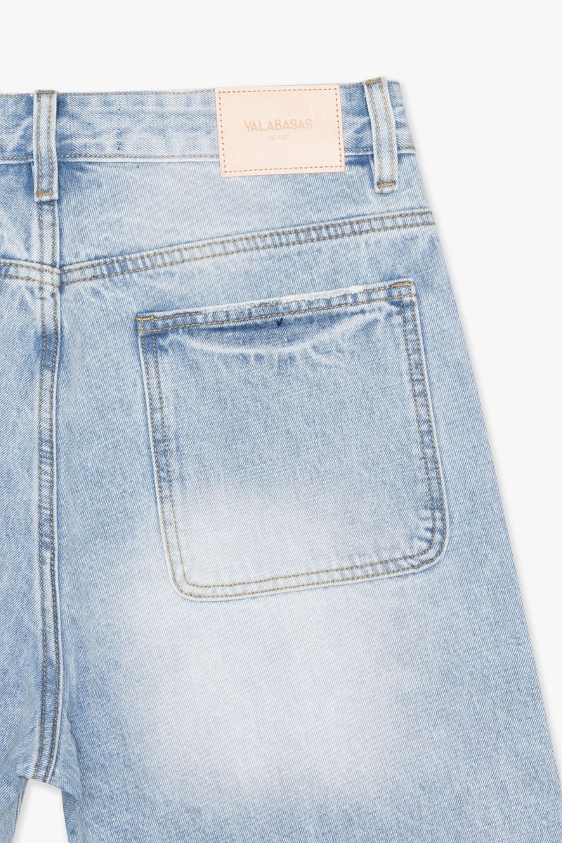 Close-up of the waistband and button closure of Valabasas Mr Shorts light blue denim shorts