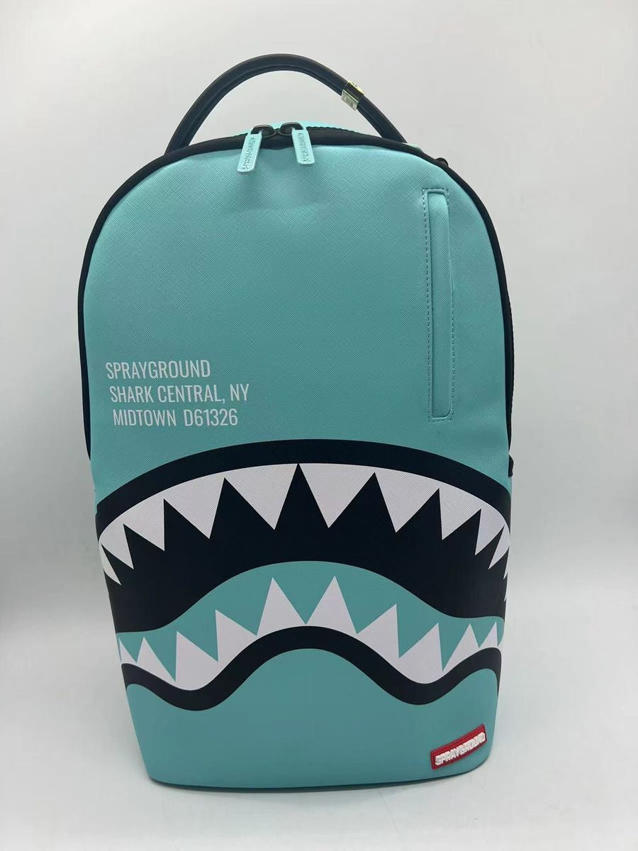 Close-up of the Sprayground Shark Central Aqua DLXSV Backpack highlighting 100% PVC material and sturdy zippers