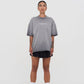  Full-length display of the oversized grey wash T-shirt worn casually, demonstrating its relaxed fit and versatile style