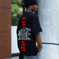 Detail shot of the rhinestone embellishments forming the octopus pattern on the black tee