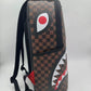 Front view of the Sprayground Split Sip Pink Check Backpack highlighting its 18-inch height and stylish design
