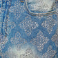 Back view of embellished denim shorts showcasing the intricate geometric patterns and high-quality denim