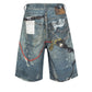 Blue denim shorts with a relaxed fit, all-over graphic print, heavyweight fabric, and sandblast wash finish