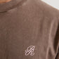 Side angle of PURE Monclair Brown Tee emphasizing its relaxed oversized cut and comfortable fit