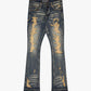 Dark vintage wash stacked denim jeans featuring tearaway design and rugged style
