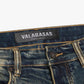 Stacked denim jeans in dark vintage wash by Valabasas, showcasing tearaway feature and stylish construction