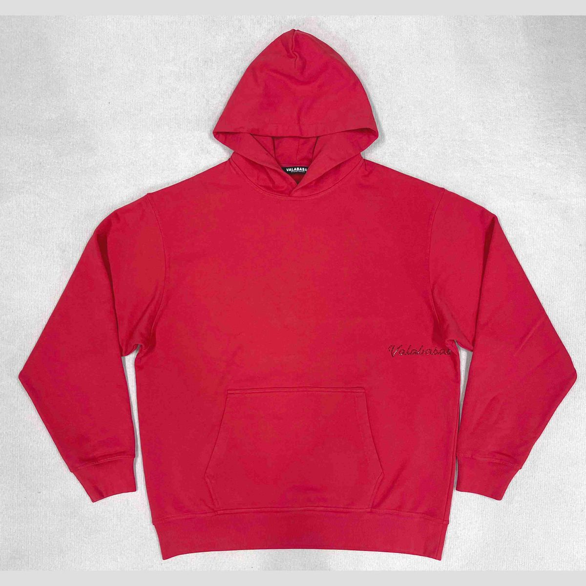 Red Valabasas hoodie made of high-quality material and featuring a front pocket