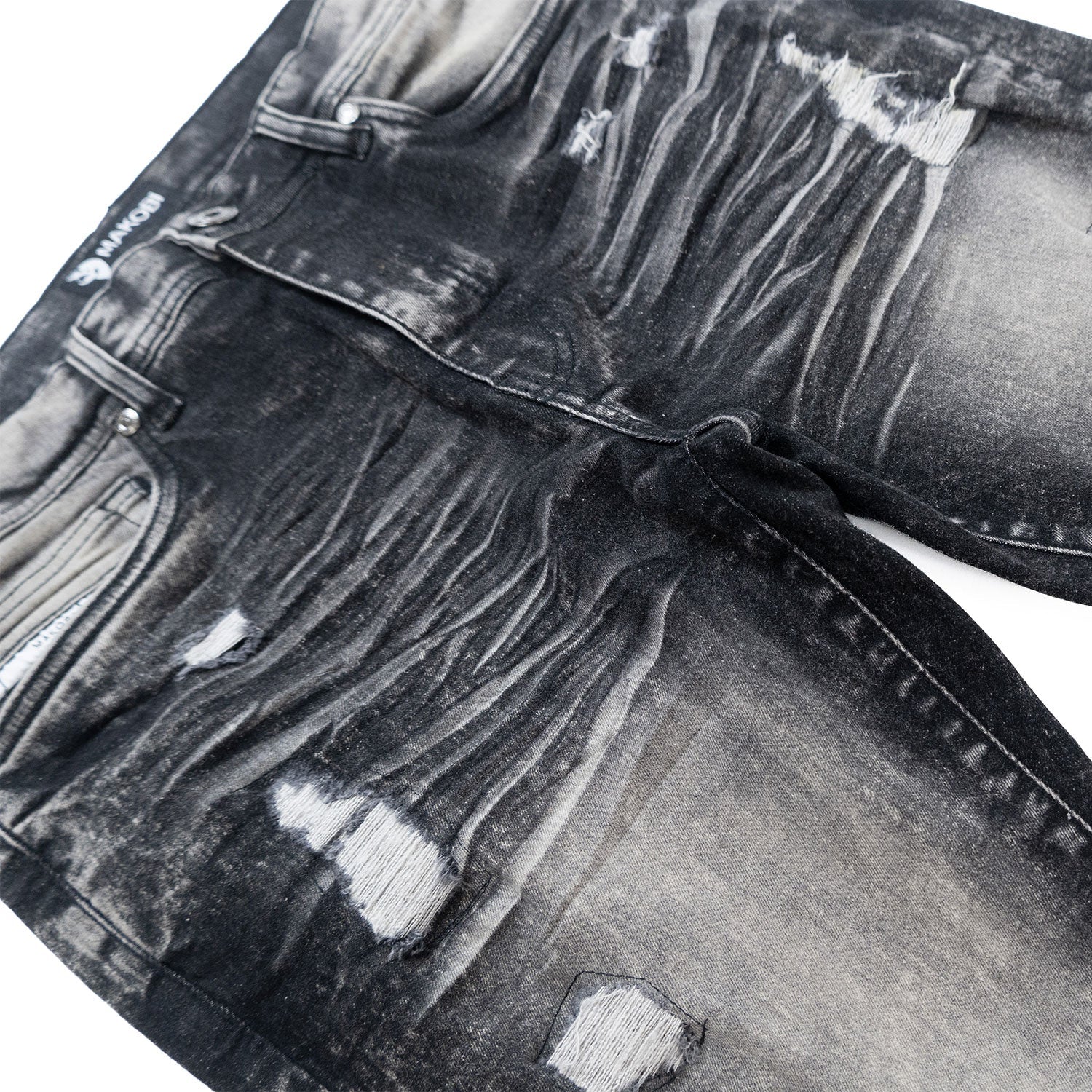 Side view of Makobi Moreli Black Wash Denim Jeans demonstrating original design and trendy appeal