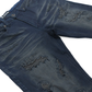 A detailed close-up image of Makobi Romano Vintage Blue Denim Jeans (M1934) showcasing classic distressed texture, stylish fit, and high-quality fabric with prominent stitching and trendy faded design